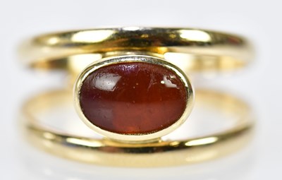 Lot 198 - A 14ct yellow gold and carnelian cabochon set...