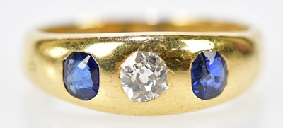 Lot 116 - An 18ct yellow gold diamond and sapphire three...