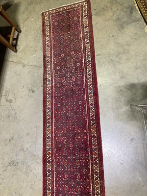 Lot 570 - A Persian runner Length; 507cm x Width; 83cm