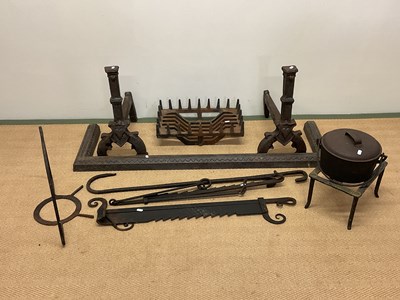 Lot 148 - Metalware including fire dogs, a fender, a pot...