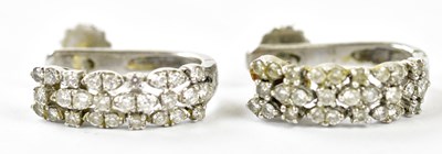 Lot 639 - A pair of 18ct white gold diamond half hoop...