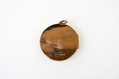 Lot 455 - A 9ct rose gold circular locket engraved with...