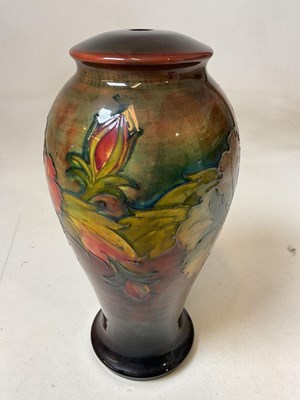 Lot 217 - MOORCROFT; a large early flambe floral...