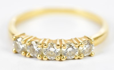 Lot 83 - An 18ct yellow gold five stone diamond ring...