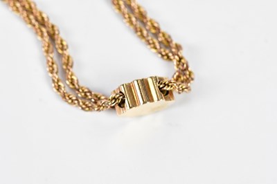 Lot 375 - A 9ct rose gold rope twist double chain with...