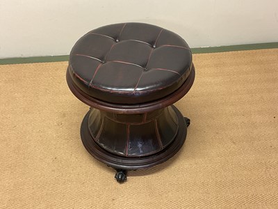 Lot 636 - A circular leather stool with storage, height...