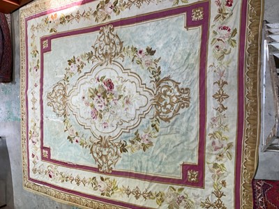 Lot 99 - An early 20th century tapestry floor covering...