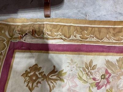 Lot 99 - An early 20th century tapestry floor covering...