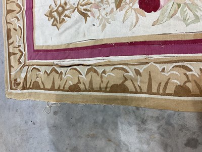 Lot 99 - An early 20th century tapestry floor covering...