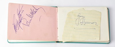 Lot 157 - THE BEATLES; an autograph book bearing...