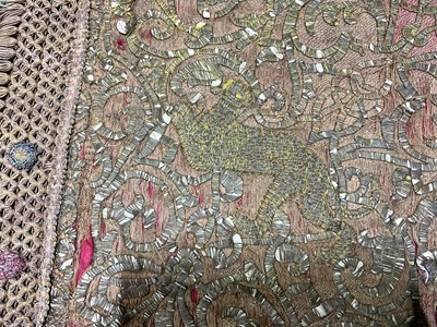 Lot 102 - An Indian wirework, intricately embroidered,...