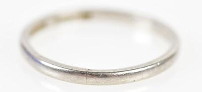 Lot 217 - A platinum wedding band, size Q, approx 3g.