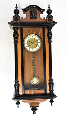 Lot 102 - A Vienna wall clock with mahogany ebonised...