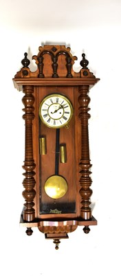 Lot 100 - A Vienna mahogany cased wall clock, the...