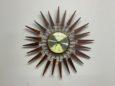 Lot 512 - PAICO; a 1960s starburst wall clock in brass...