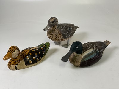 Lot 29 - Three hand painted wooden decoy ducks, the...