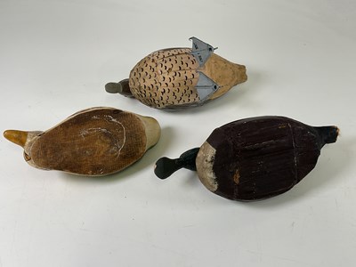 Lot 29 - Three hand painted wooden decoy ducks, the...