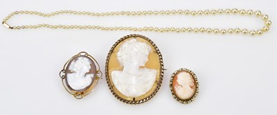 Lot 332A - A 9ct gold mounted cameo style brooch, two...