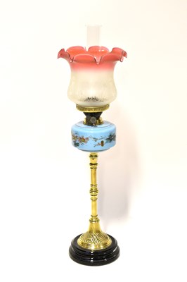 Lot 77 - A Victorian brass oil lamp with painted blue...