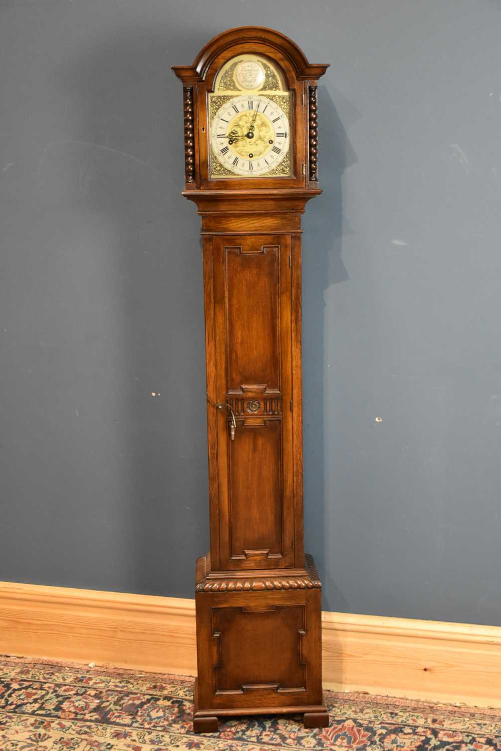 Lot 6452 - A 1950s oak cased grandmother clock, the...