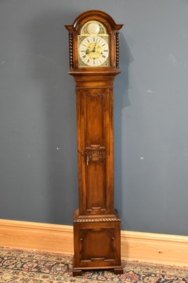 Lot 6452 - A 1950s oak cased grandmother clock, the...