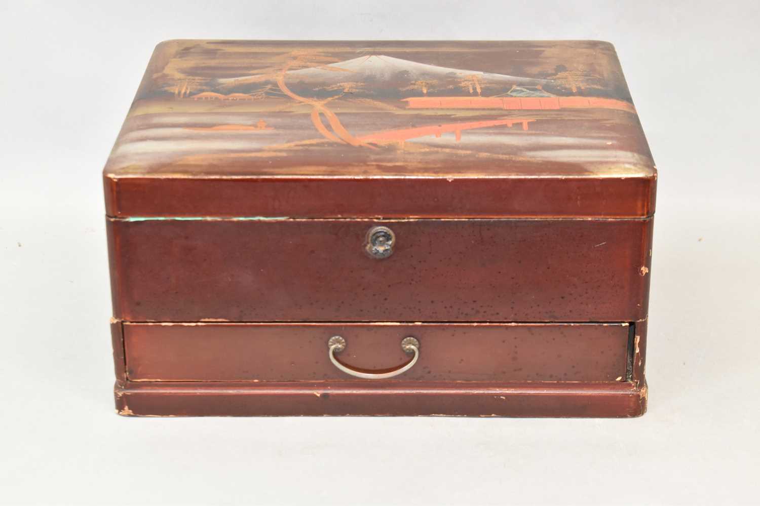Lot 601 - A Japanese red lacquer vanity box with hinged...