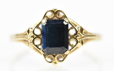 Lot 138 - A yellow metal sapphire dress ring with...