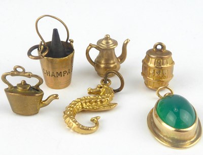 Lot 1123 - Five 9ct gold charms, comprising teapot,...