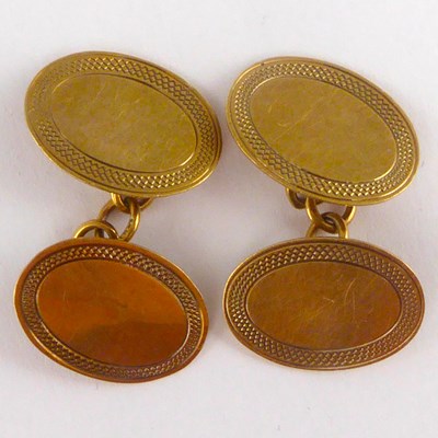 Lot 1118 - A pair of 9ct gold oval cufflinks united with...