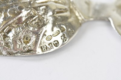 Lot 2656 - B MULLER; a hallmarked silver caddy spoon, the...