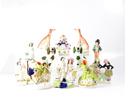 Lot 541 - A group of Staffordshire figures, including a...