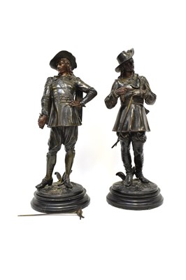 Lot 653 - A pair of bronzed spelter figures of Cavaliers,...