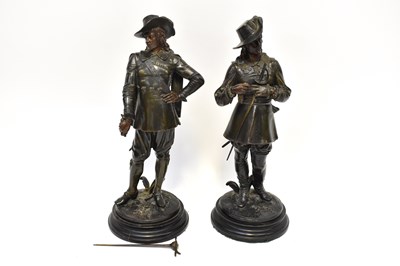 Lot 653 - A pair of bronzed spelter figures of Cavaliers,...