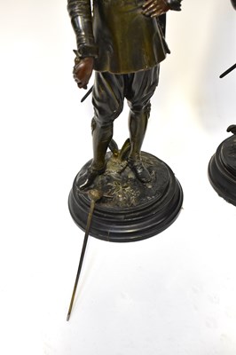 Lot 653 - A pair of bronzed spelter figures of Cavaliers,...