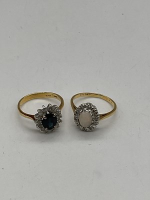 Lot 391 - An 18ct yellow gold diamond and opal oval...