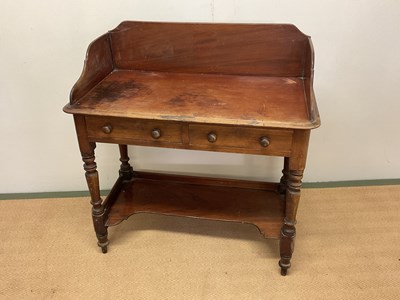 Lot 670 - A mahogany washstand with two drawers and...