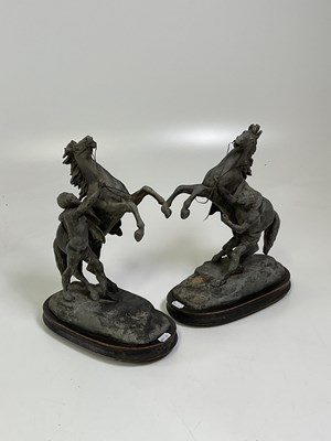 Lot 142 - AFTER COUSTOU; a pair of spelter Marly horses,...