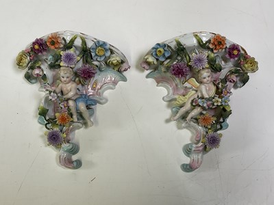 Lot 229 - A pair of Meissen wall consoles with cherubs...