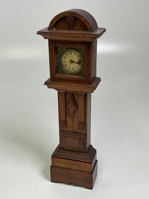 Lot 513 - A mantel clock in form of a long case clock,...