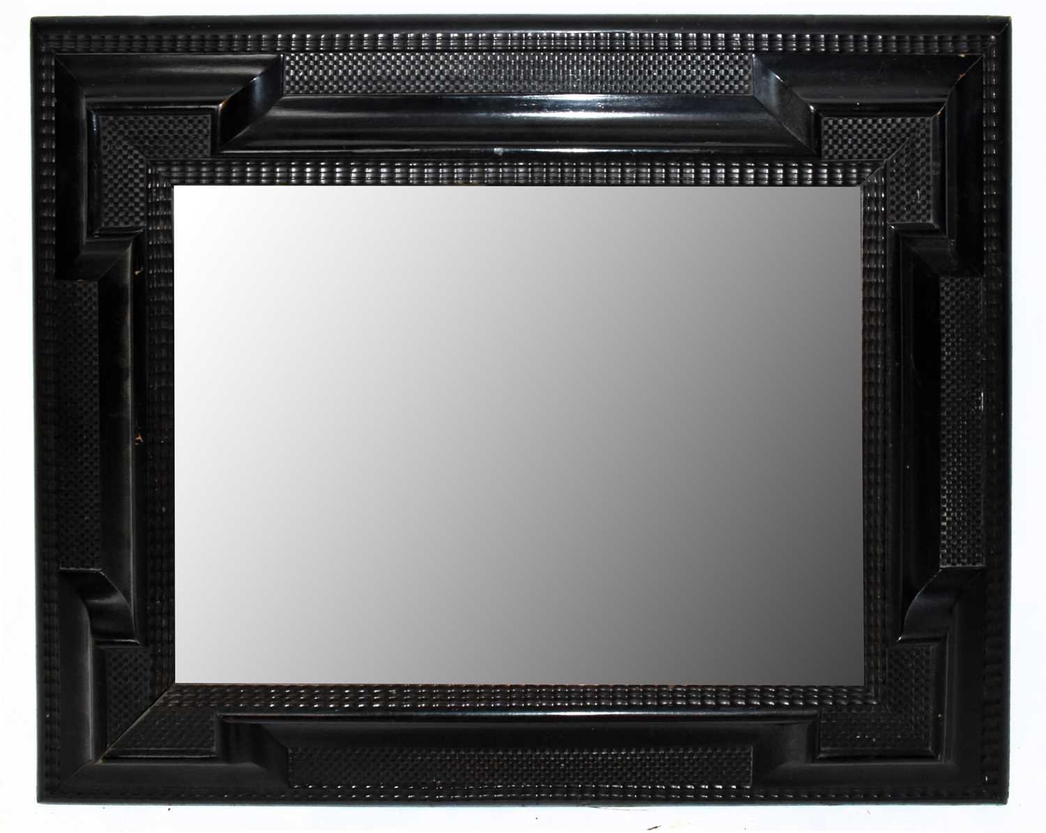 Lot 1715 A 20th century ebonised wall mirror, 70 x