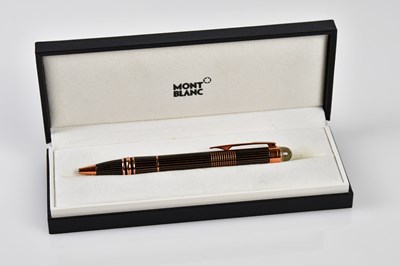 Lot 971 - MONTBLANC; a rose gold metal Starwalker...