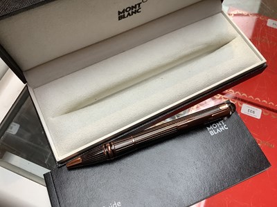 Lot 971 - MONTBLANC; a rose gold metal Starwalker...