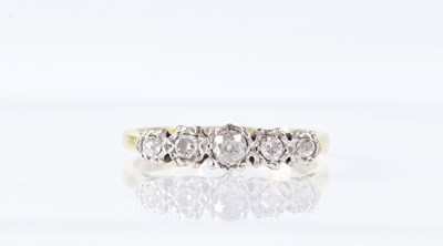 Lot 1051 - An 18ct yellow gold and platinum ring set with...