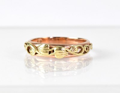 Lot 1016 - A 9ct rose gold ring with yellow gold...