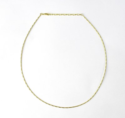 Lot 1095 - A 9ct gold semi-rigid necklace, length 44cm,...