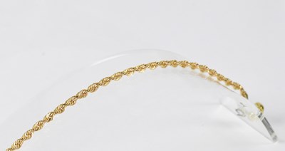 Lot 1063 - A 9ct gold bracelet with magnetic clasp,...