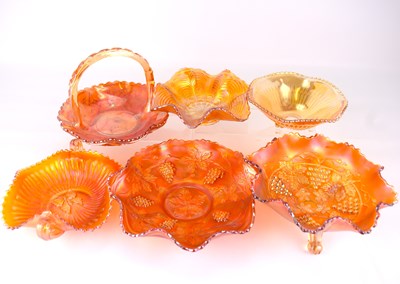 Lot 638 - Six items of marigold-coloured carnival glass,...