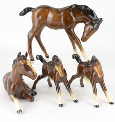 Lot 549 - BESWICK; four brown gloss foals, the largest...