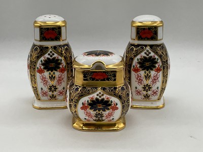 Lot 208 - Royal Crown Derby three piece cruet.