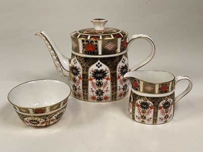 Lot 211 - Royal Crown Derby teapot, cream jug and sugar...